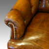 Victorian small leather settee arm button