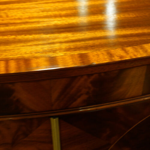 Mahogany bow front small linen press cross banding to top