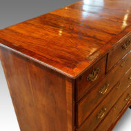 Queen Anne walnut and oak chest top detail