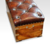 Victorian camphorwood and leather ottoman end view