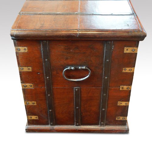 Antique teak trunk with iron straps and brass corners end view