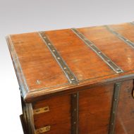 Antique teak trunk with iron straps and brass corners top