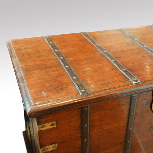 Antique teak trunk with iron straps and brass corners top