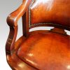 Edwardian mahogany swivel desk chair arm
