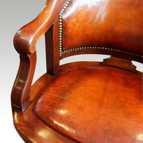 Edwardian mahogany swivel desk chair arm