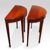 Edwardian pair of mahogany demi lune console tables side view