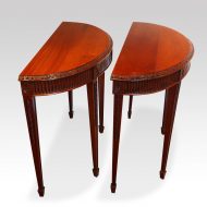 Edwardian pair of mahogany demi lune console tables side view