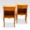 Pair of French walnut inlaid marble top bedside cabinets