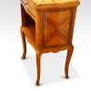 Pair of French walnut inlaid marble top bedside cabinets angle view