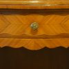 Pair of French walnut inlaid marble top bedside cabinets drawer front