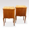 Pair of French walnut inlaid marble top bedside cabinets rear