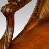 Pair of William IV mahogany library chairs arm carving
