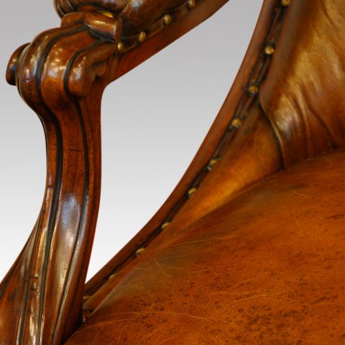 Pair of William IV mahogany library chairs arm carving