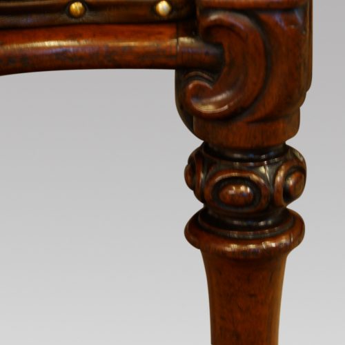 Pair of William IV mahogany library chairs leg carving