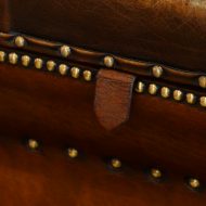 Victorian shaped leather Ottoman lifting tag