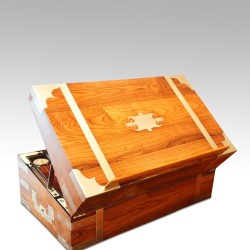 Antique kingwood writing slope lid supported