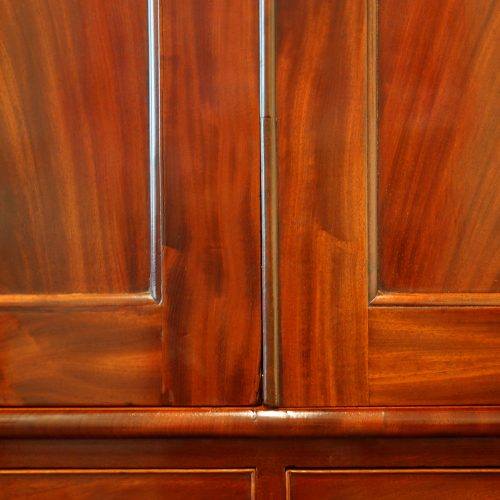 Antique mahogany linen press door detail
