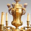 Edwardian brass 8 light chandelier figures