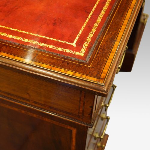 Edwardian inlaid mahogany pedestal desk top detail