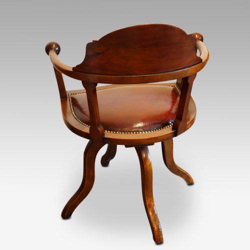 Edwardian mahogany ball arm revolving desk chair rear