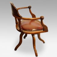 Edwardian mahogany ball arm revolving desk chair side