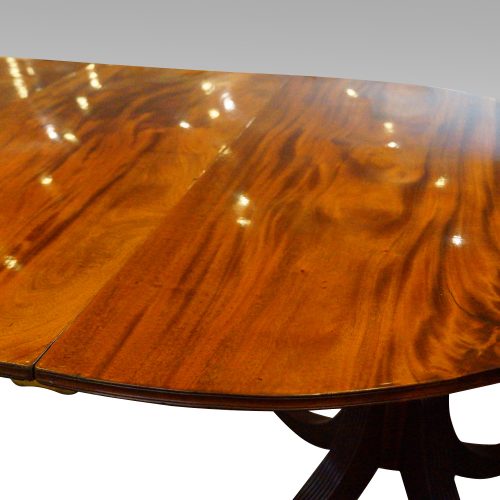 Antique mahogany twin pillar dining table top detail