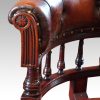 Edwardian mahogany horse shoe shaped desk chair arm detail
