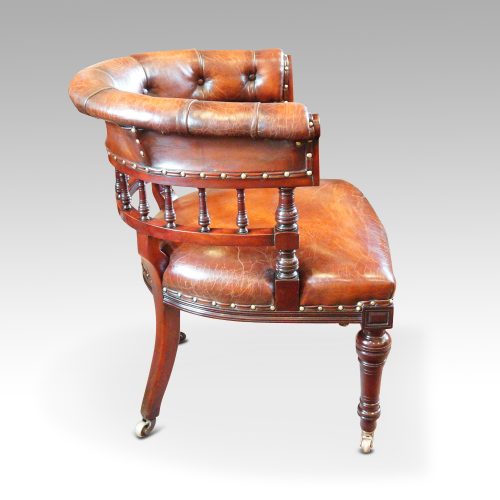 Edwardian mahogany horse shoe shaped desk chair side view