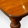 Edwardian walnut extending dining table end from side