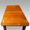 Edwardian walnut extending dining table end view