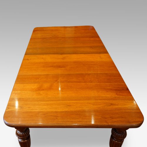 Edwardian walnut extending dining table end view