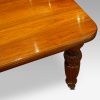 Edwardian walnut extending dining table high view