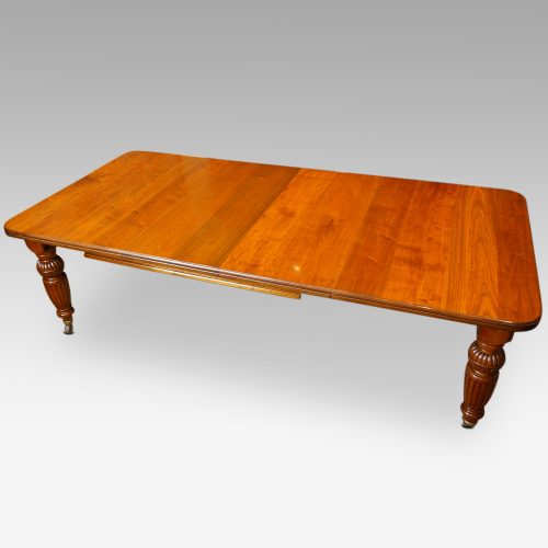 Edwardian walnut extending dining table top view