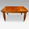 Edwardian walnut extending dining table without leaves