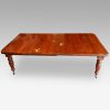 Edwardian walnut extending dining table, by Hampton & sons