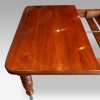Edwardian walnut extending dining table, by Hampton & sons end