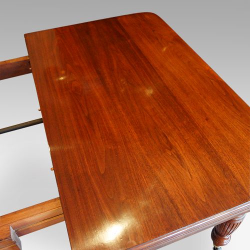 Edwardian walnut extending dining table, by Hampton & sons end of top
