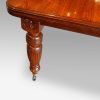 Edwardian walnut extending dining table, by Hampton & sons leg