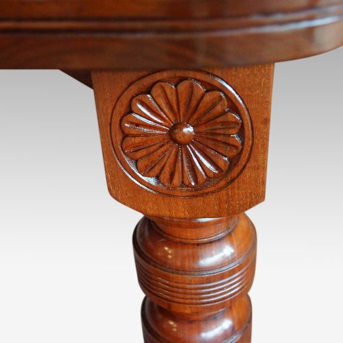 Edwardian walnut extending dining table, by Hampton & sons leg carving