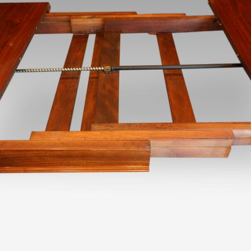 Edwardian walnut extending dining table, by Hampton & sons mechanism