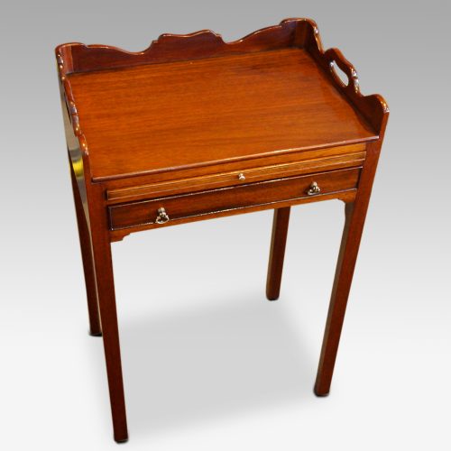 Pair of mahogany tray top bedside tables angle
