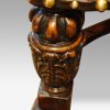 Pair of oak and leather wing chairs carving detail