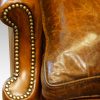 Pair of oak and leather wing chairs front of arm