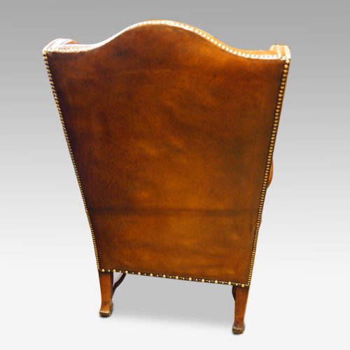 Pair of oak and leather wing chairs rear
