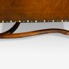 Pair of oak and leather wing chairs side stretcher