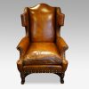 Pair of oak and leather wingchairs single