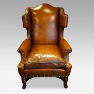 Pair of oak and leather wingchairs single