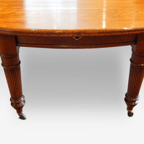 Victorian oak extending dining table end