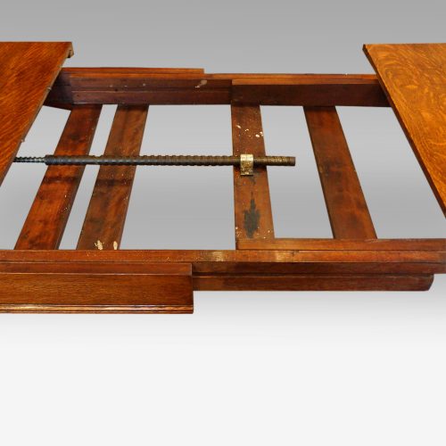 Victorian oak extending dining table extended