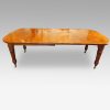 Victorian oak extending dining table side